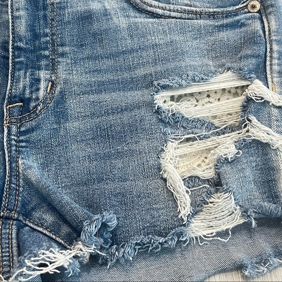 AMERICAN EAGLE Next Level Stretch Hi-Rise Shortie Distressed Blue Jean Shorts - Picture 2 of 9